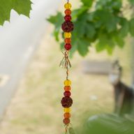 Indické zvonky - mosazný Květ života se rudrakšovými korálkami na šňůře - 6x63 cm